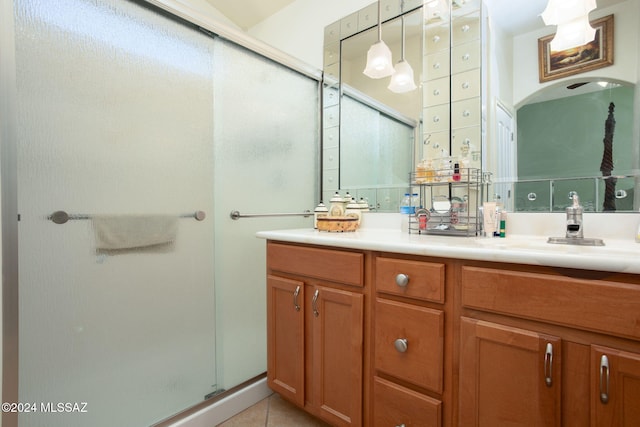 bathroom with vanity, tile patterned flooring, and an enclosed shower