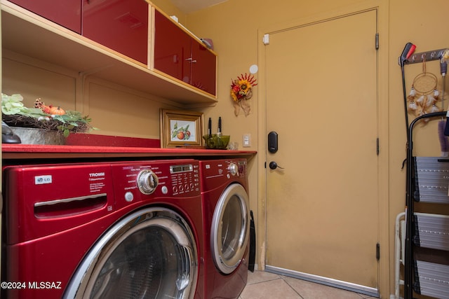 washroom featuring separate washer and dryer and light tile patterned floors