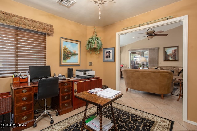 office featuring ceiling fan, lofted ceiling, and light tile patterned flooring