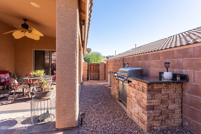 view of patio / terrace featuring a grill and ceiling fan