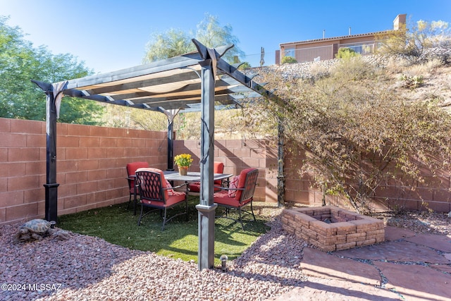 view of yard with a patio, an outdoor fire pit, and a pergola