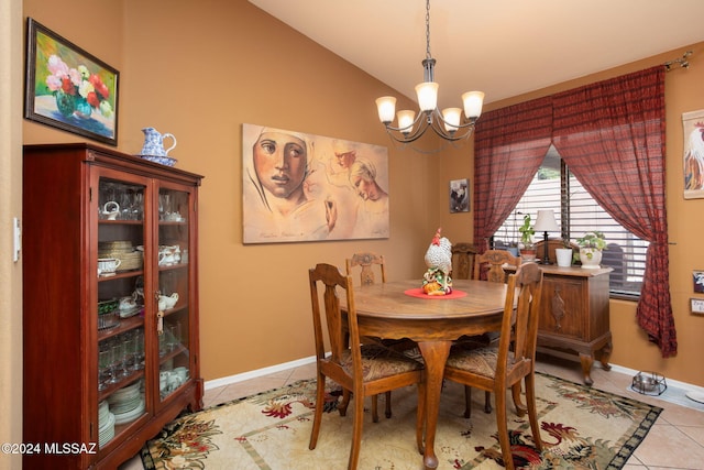 dining area with vaulted ceiling, light tile patterned floors, and an inviting chandelier