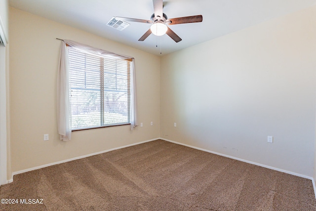 unfurnished room featuring ceiling fan and carpet floors