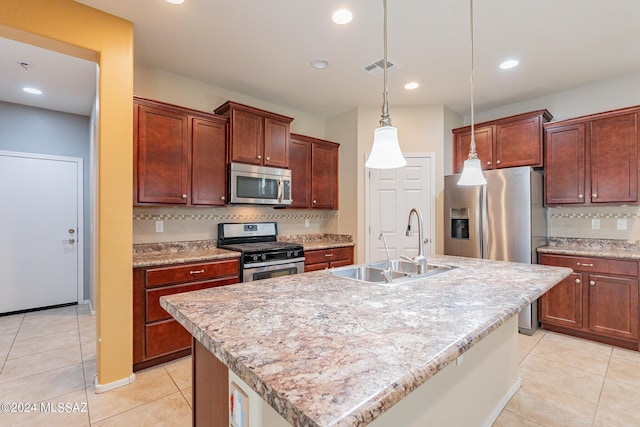 14031 E Troika St, Vail, AZ 85641 - kitchen featuring appliances with stainless steel finishes, decorative backsplash, light tile patterned floors, light countertops, and hanging light fixtures