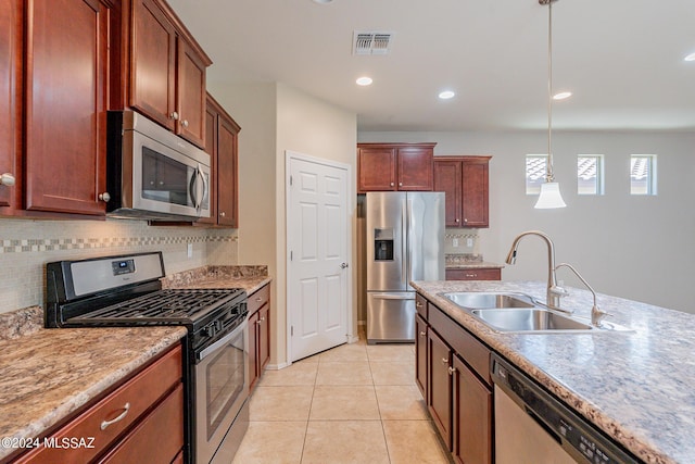 14031 E Troika St, Vail, AZ 85641 - kitchen with stainless steel appliances, backsplash, pendant lighting, light tile patterned flooring, and recessed lighting