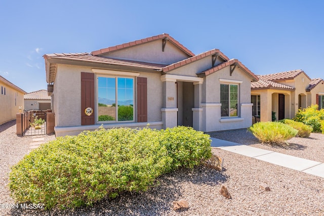 14031 E Troika St, Vail, AZ 85641 - mediterranean / spanish-style house with stucco siding, a tiled roof, and a gate