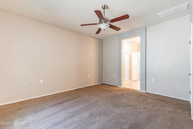 carpeted empty room with ceiling fan