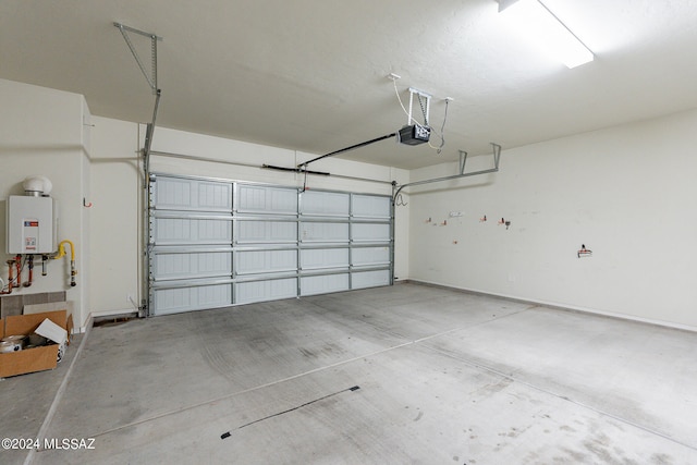 garage featuring tankless water heater and a garage door opener