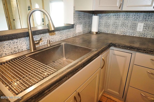 kitchen with sink and decorative backsplash