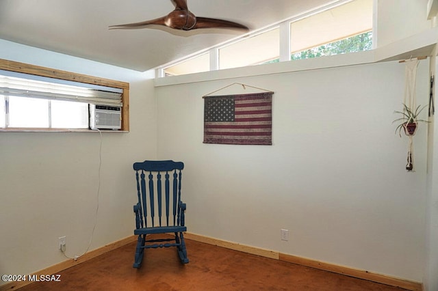 sitting room with cooling unit and plenty of natural light