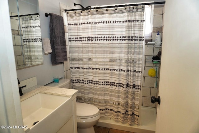 bathroom with vanity, toilet, and a shower with shower curtain