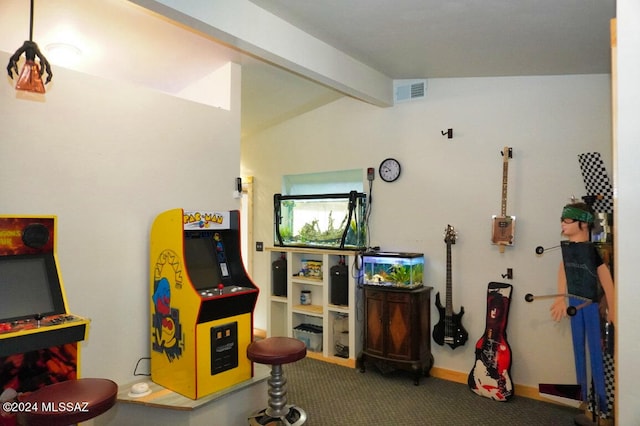 recreation room featuring carpet floors and vaulted ceiling with beams