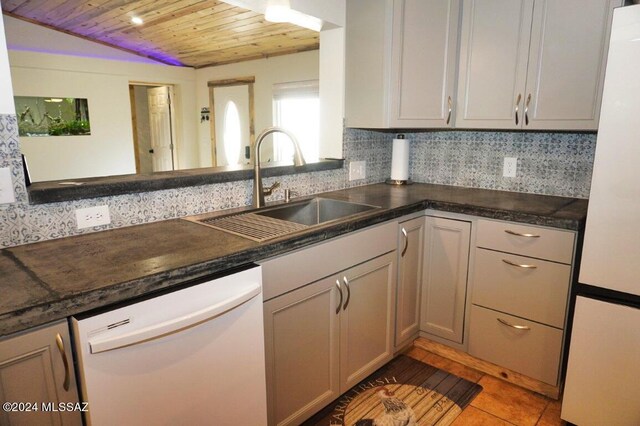 kitchen with backsplash, wood ceiling, vaulted ceiling, and stainless steel appliances