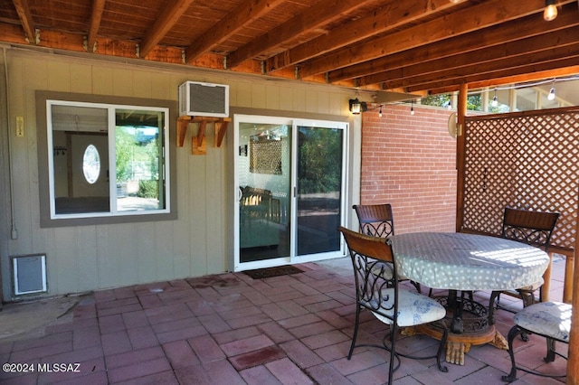 view of patio with a wall mounted air conditioner