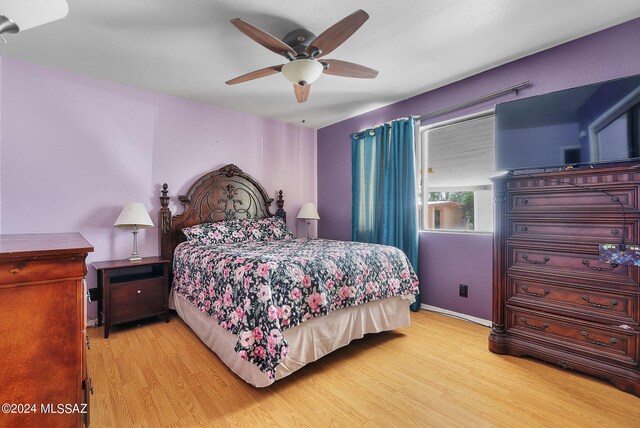 bedroom with light wood-type flooring and ceiling fan