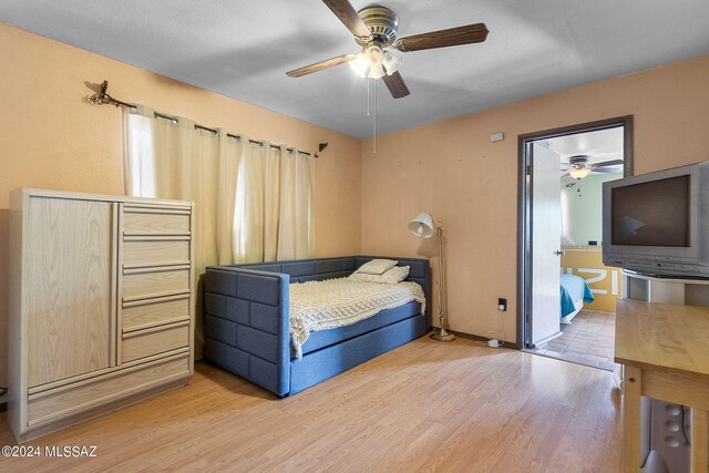 bedroom featuring light hardwood / wood-style floors and ceiling fan