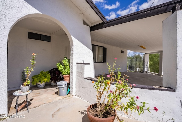 property entrance featuring a patio