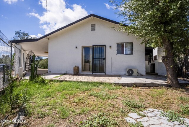 rear view of property with a patio area