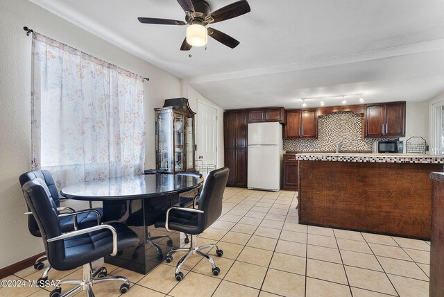 dining room featuring ceiling fan and light tile patterned floors