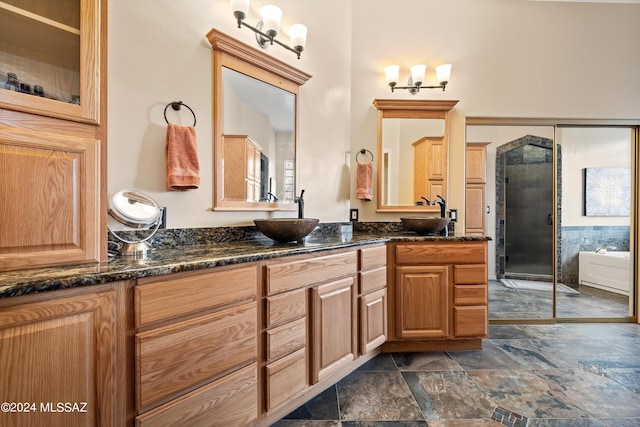 bathroom with independent shower and bath and vanity