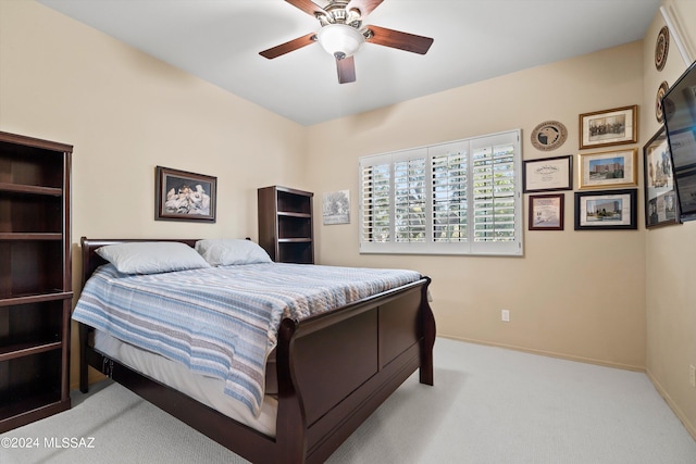 bedroom featuring ceiling fan and light colored carpet