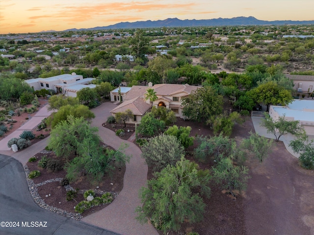 aerial view at dusk with a mountain view