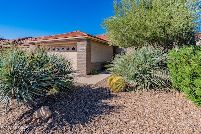 view of property exterior featuring a garage