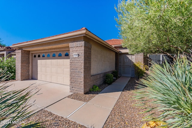 view of property exterior featuring a garage