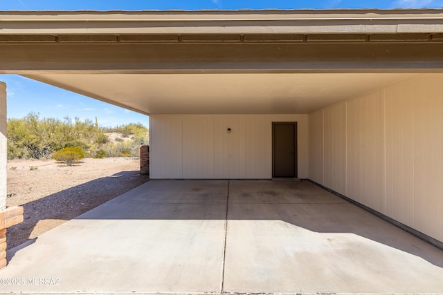 garage with an attached carport