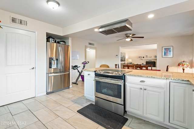 kitchen featuring ceiling fan, stainless steel appliances, light stone counters, and white cabinetry