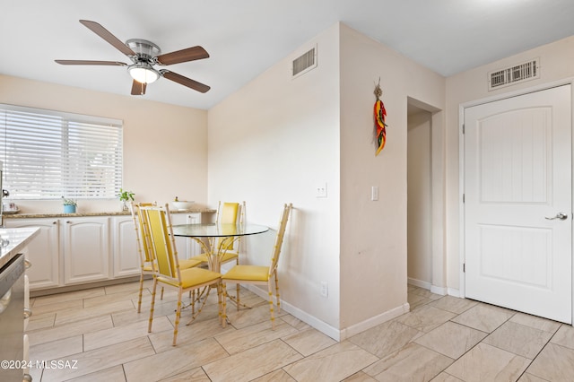 dining space with ceiling fan