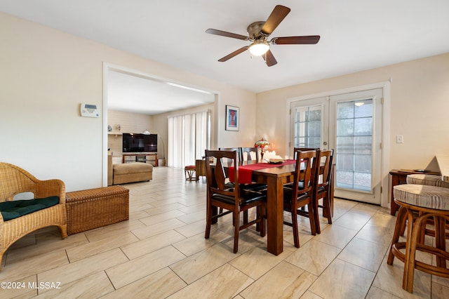 dining area with ceiling fan, french doors, and a wealth of natural light