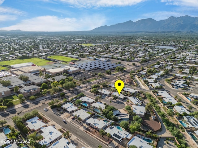 birds eye view of property featuring a mountain view