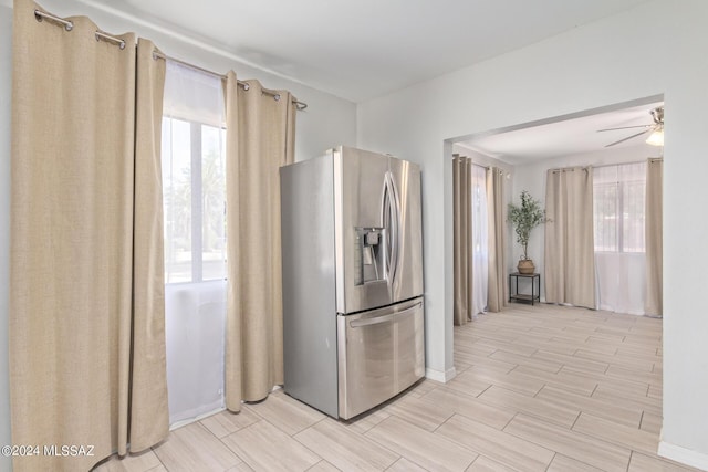 kitchen featuring stainless steel fridge and ceiling fan