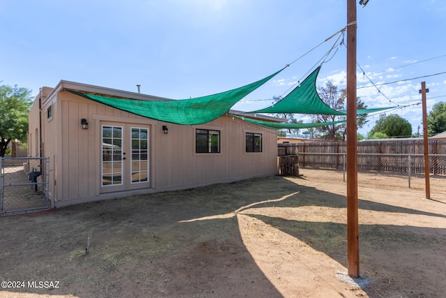 back of property featuring french doors