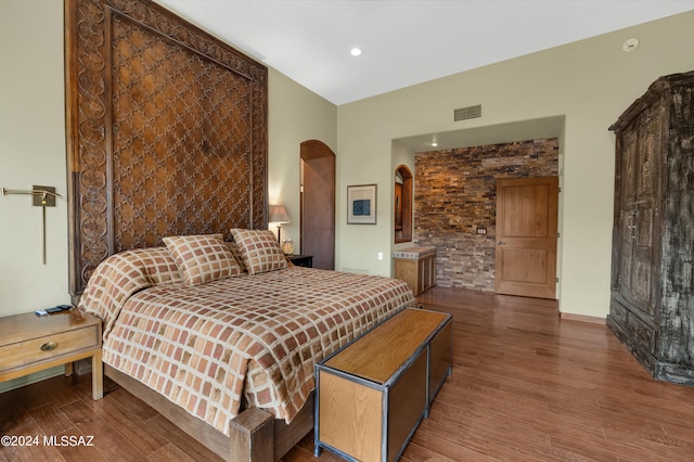 bedroom featuring dark wood-type flooring