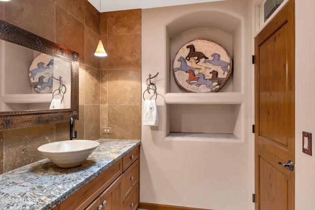 bathroom featuring backsplash and vanity