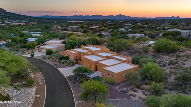 aerial view at dusk with a mountain view