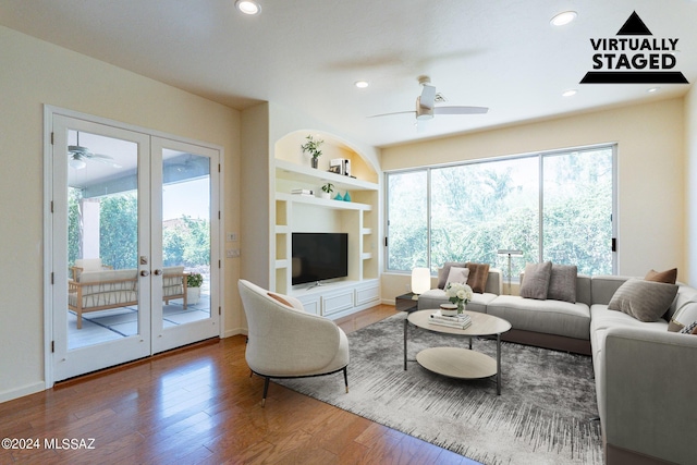 living room with recessed lighting, french doors, ceiling fan, built in features, and wood finished floors