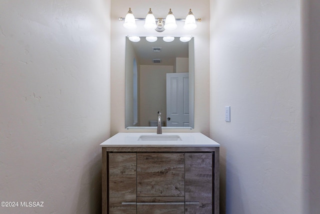 bathroom featuring vanity and visible vents