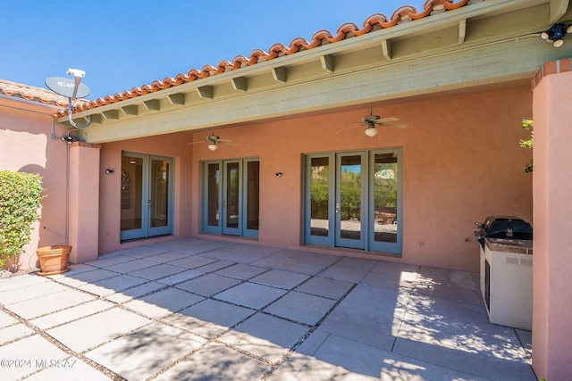 view of patio / terrace featuring ceiling fan and french doors