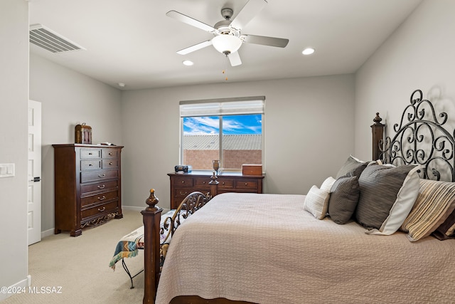 bedroom featuring light carpet and ceiling fan