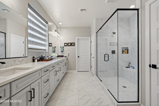 bathroom with vanity and an enclosed shower