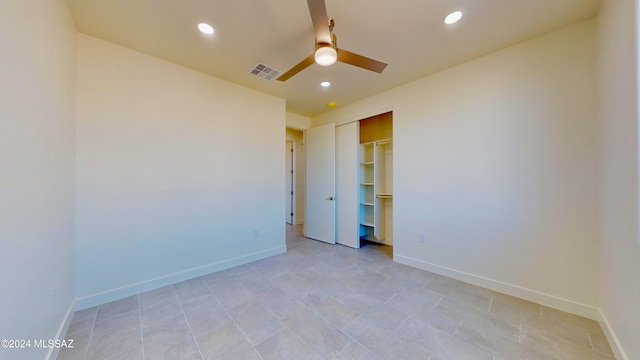 unfurnished room with ceiling fan