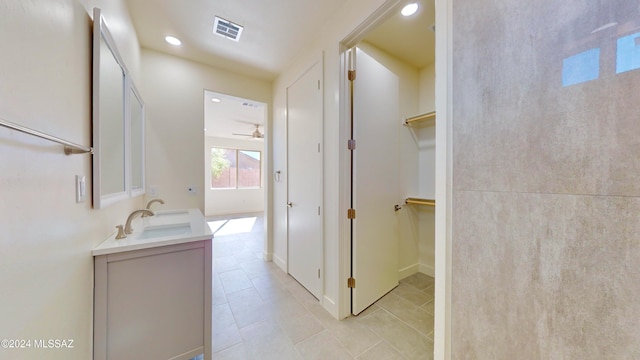 bathroom featuring tile patterned flooring, ceiling fan, and vanity