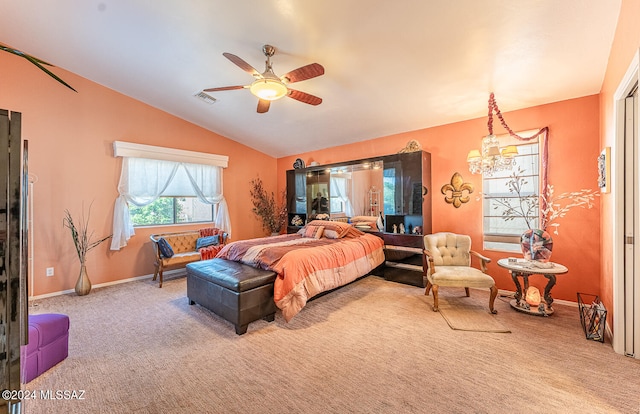 bedroom featuring ceiling fan with notable chandelier, vaulted ceiling, and carpet floors