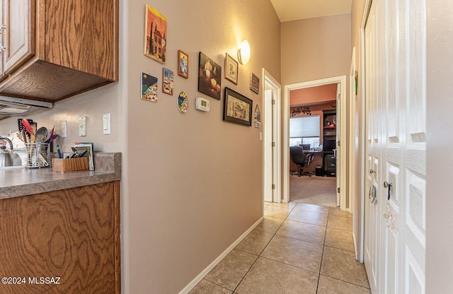 hallway featuring light tile patterned flooring