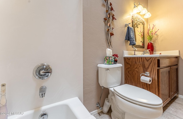 bathroom with vanity, tile patterned flooring, toilet, and a washtub