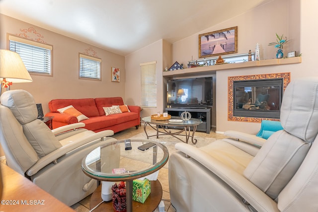 living room featuring vaulted ceiling and tile patterned floors