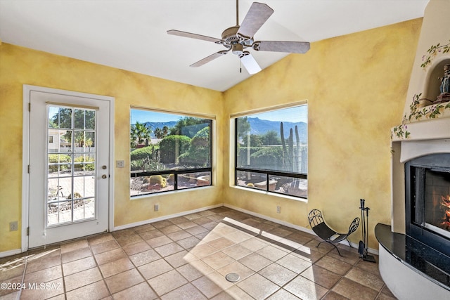 unfurnished sunroom with lofted ceiling and ceiling fan